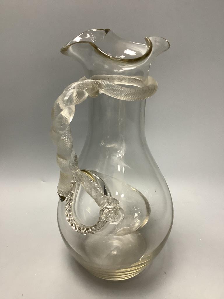 A 19th century glass lemonade jug with snake handle and ice compartment, height 33cm